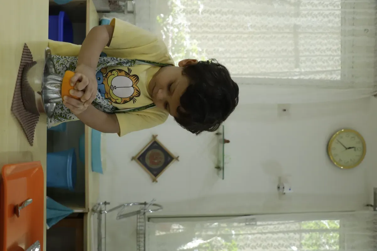 Toddler cutting vegetables